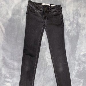 Black hollister low rise black skinny jeans